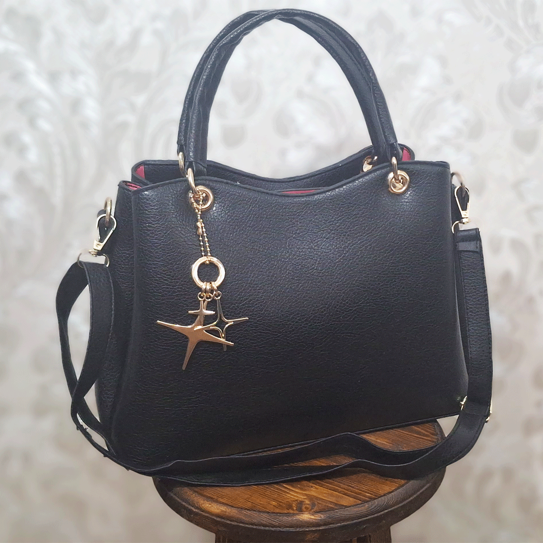 کیف-مجلسی-ستاره کیف زنانه مشکی با آویز ستاره - Image 1
